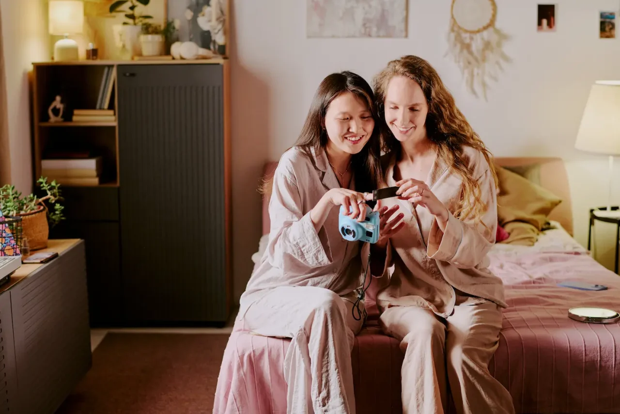 Two roommates looking at photos